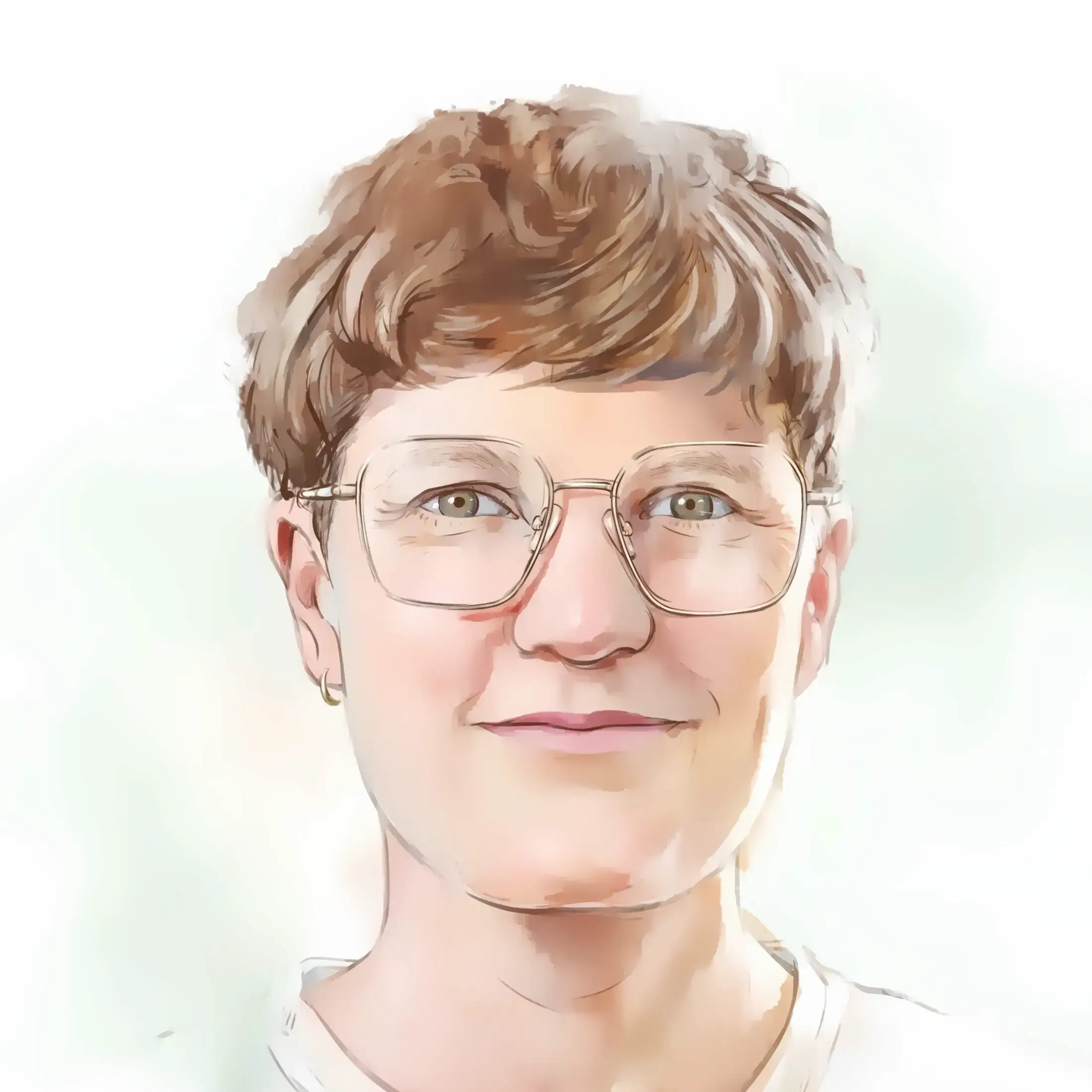 René lächelt in die Kamera. René trägt kurze braune Haare, ein weißes T-Shirt und eine Brille mit einem dünnen Rand.